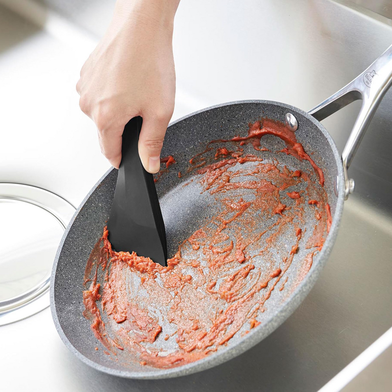 Scraper magnetically attached to different kitchen surfaces in three views.

