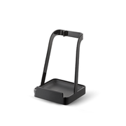A product image of the black Yamazaki Tower Series Utensil and Lid Stand, showing its minimalist design and drip tray base on a white background.

