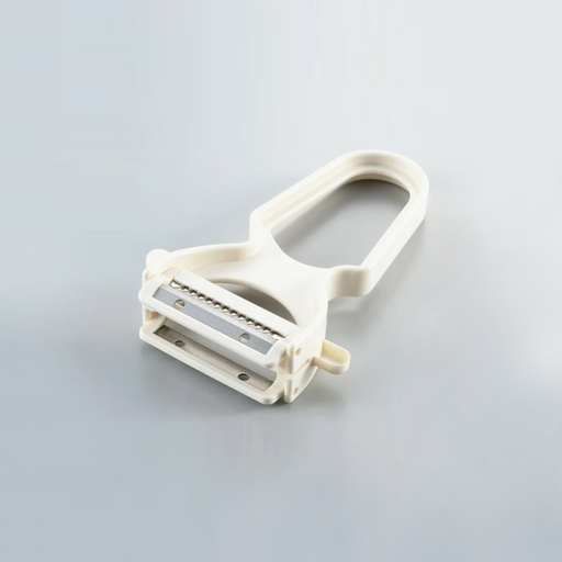 A white Yoshikawa double-blade peeler featuring both straight and julienne stainless steel blades on a grey background.