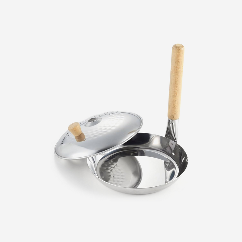 A product image of the Yoshikawa 16cm Oyakodon Pan, showing its unique vertical wooden handle and matching stainless steel lid.

