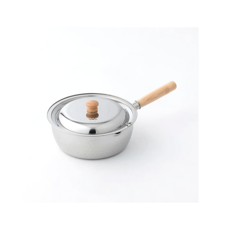 Small stainless steel pot with a wooden handle and lid on a white background