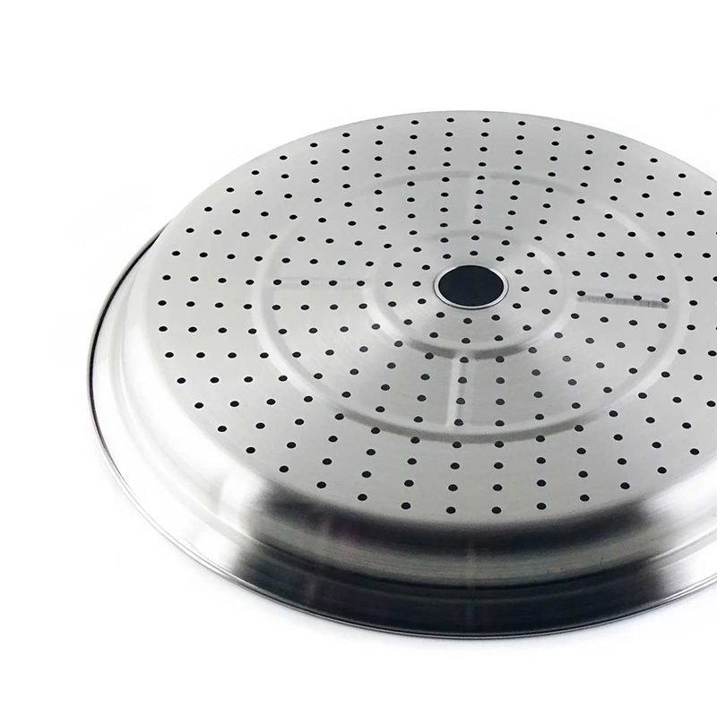 A close-up, angled view of the Yoshikawa Cook-Pal Stainless Steel Steamer - 36cm insert. It is a round, shallow, silver-coloured metal tray with many small, evenly spaced holes and a larger central hole.