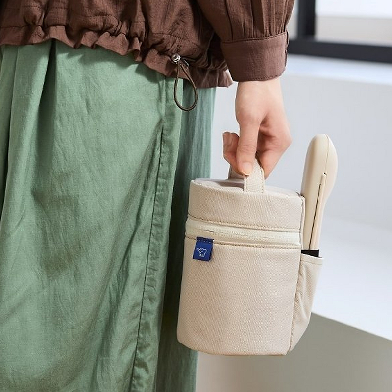 Zojirushi beige insulated food jar pouch with a side pocket holding a matching cutlery case (spoon and chopstick set).
