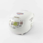 The Zojirushi Neuro Fuzzy 10-cup rice cooker, showing its classic white egg-shaped design and detailed digital control panel with multiple menu settings.


