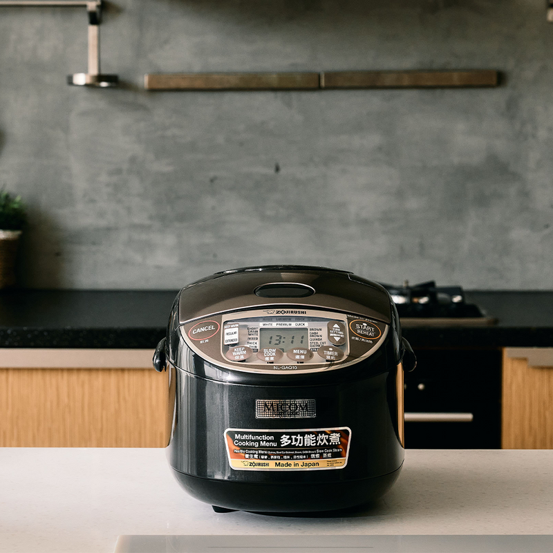 Zojirushi Micom Multifunctional Rice Cooker NL-GAQ18/NL-GAQ10 displayed on a kitchen counter.