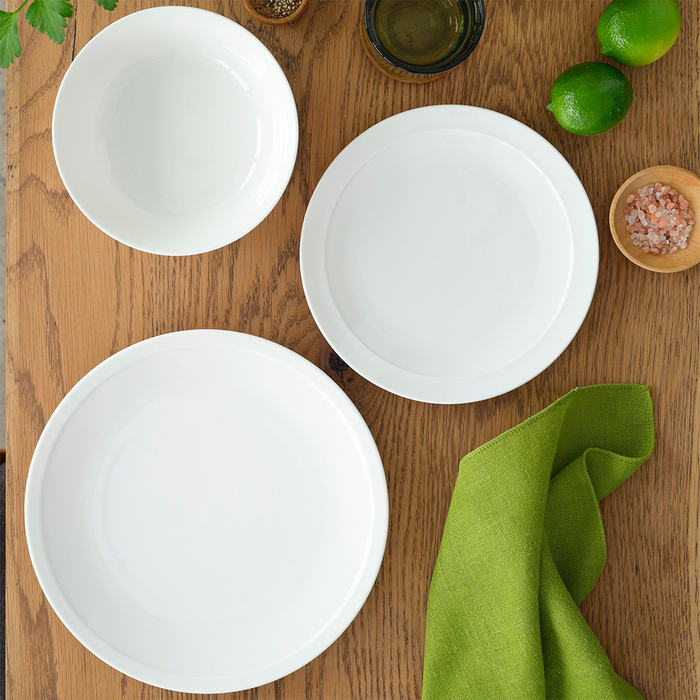 The same flat lay featuring the Adam Liaw Everyday Noritake dinnerware set, but with different angles to highlight the minimalist design of the plates and bowls.