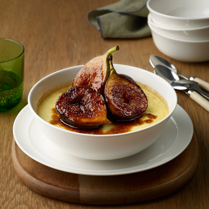 A dessert with caramelized figs served in the Adam Liaw Everyday Noritake bowl, placed on a 25cm large plate.