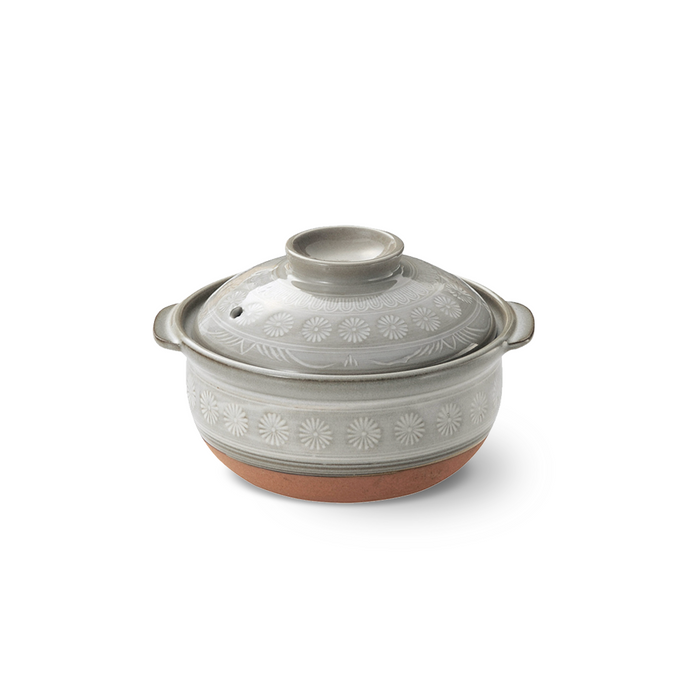 Ginpo Hana Mishima Mini Donabe Japanese Clay Pot with its lid on, highlighting the intricate white floral patterns on the grey surface and the terracotta-coloured base.