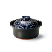 A product image of the 5-cup Ginpo Kikka donabe rice pot, showing the black clay base and the glossy, patterned dark blue lid.

