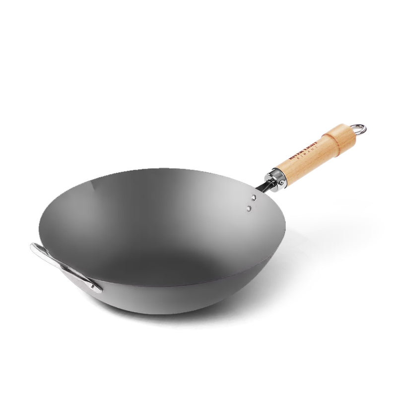 A product image of the River Light Kiwame 33cm Carbon Steel Wok, featuring its long wooden handle and a smaller helper handle for easy lifting.