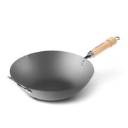 A product image of the River Light Kiwame 36cm Carbon Steel Wok, featuring its long wooden handle and a smaller helper handle for easy lifting.