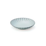 A photo of the Aito Seto Yaki Hana Side Plate in light blue, showcasing its fluted, flower-like shape and subtle colour variations.
