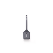 The Happycall VIVA one-piece silicone turner in dark grey, showing its wide slotted head, against a white background.
