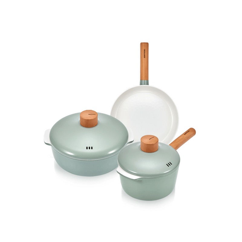 The 5-piece Happycall Zium ceramic nonstick cookware set in a sage green finish, showing the 18cm saucepan, 24cm pot, and 24cm frypan with matching lids and light wood handles.
