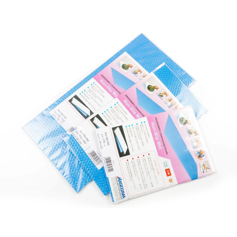 Three blue Hasegawa anti-bacterial non-slip mats shown in their retail packaging, highlighting their textured, bubble-like surface.
