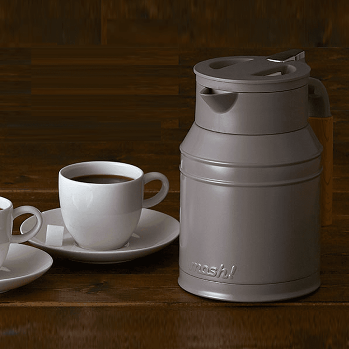 Mosh Stainless Steel Vacuum Insulated Carafe 1L Brown: on a table