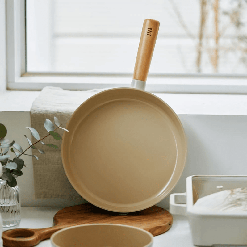 Neoflam Fika Ceramic Nonstick Induction Wok & Frypan Set with Lid - in a living room