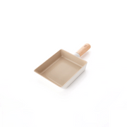The Neoflam Fika rectangular omelette pan, featuring a light-coloured ceramic nonstick interior and a natural wood handle.
