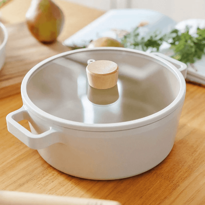 Neoflam Fika Ceramic Nonstick Induction Pot - 22cm: With lid on a table