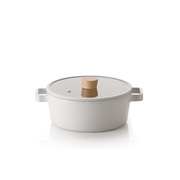 Neoflam Fika 22cm ceramic nonstick pot with a matching glass lid and wooden knob, shown on a clean white background.

