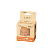 A studio photo of the Zojirushi SM-S10T-DM replacement one-touch (flip-open) lid in honey gold, shown inside its official retail box.