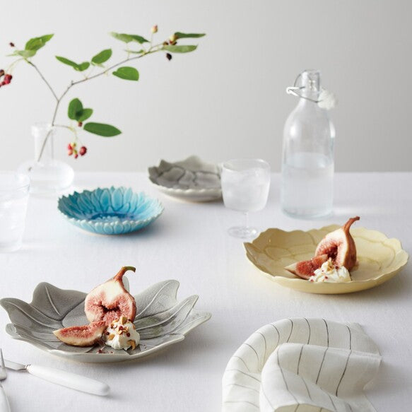Aito Seto Yaki Blossom Glazed Dinner Plate (22cm) - Glossy Ivory. Set with food.