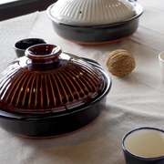 Ginpo Kikka Donabe Japanese Clay Pot 28cm (Size 9) Brown - Made in Japan. On dining table.