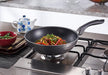 Happycall Plasma IH Titanium Wok 32cm: On gas cooktop cooking food
