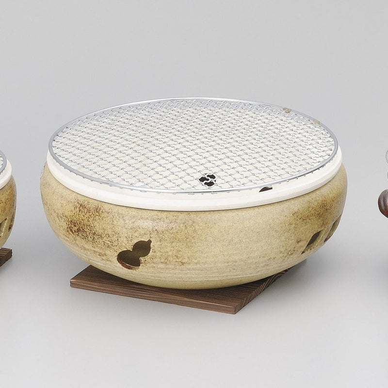 A product image of the Size 10 Ise Mizu Donabe Konro Grill in a khaki finish, shown with its wooden base and top grill mesh.

