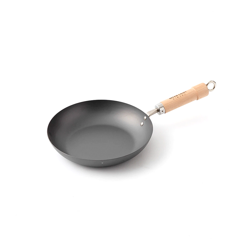 A product image of the River Light Kiwame 26cm Carbon Steel Frypan, showing its classic shape and branded natural wood handle.