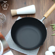Takumi Carbon Steel Wok 24cm - Made in Japan: On dining table
