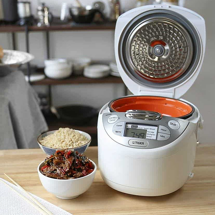 Tiger 4-in-1 Multifunctional Rice Cooker 5.5 Cups JAX-S10A: On dining table with food